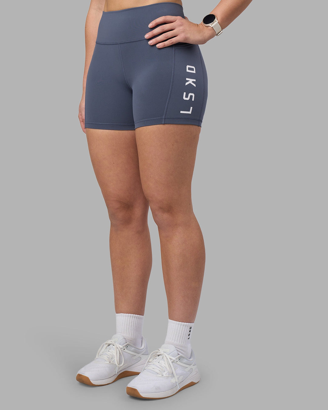 Woman wearing Rep Ultra High-Rise 4&quot; Short Pockets - Night Shadow-White | Model:Amy | Size:M