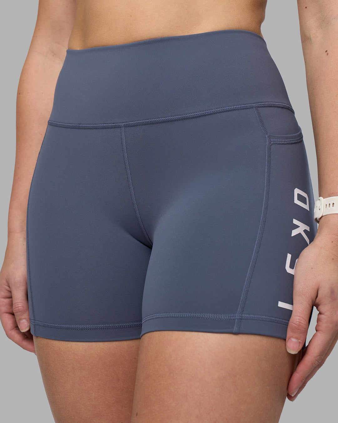 Woman wearing Rep Ultra High-Rise 4&quot; Short Pockets - Night Shadow-White | Model:Amy | Size:M