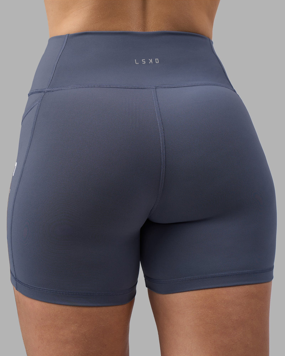 Woman wearing Rep Ultra High-Rise 4&quot; Short Pockets - Night Shadow-White | Model:Amy | Size:M