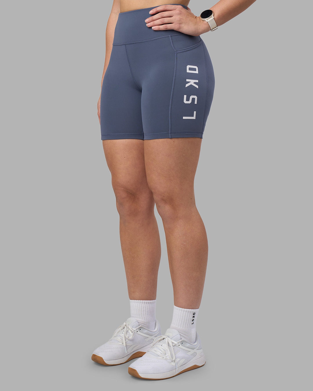 Woman wearing Rep Ultra High-Rise 6&quot; Short Pockets - Night Shadow-White | Model:Amy | Size:M