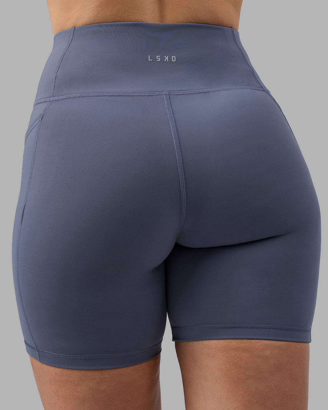 Woman wearing Rep Ultra High-Rise 6&quot; Short Pockets - Night Shadow-White | Model:Amy | Size:M