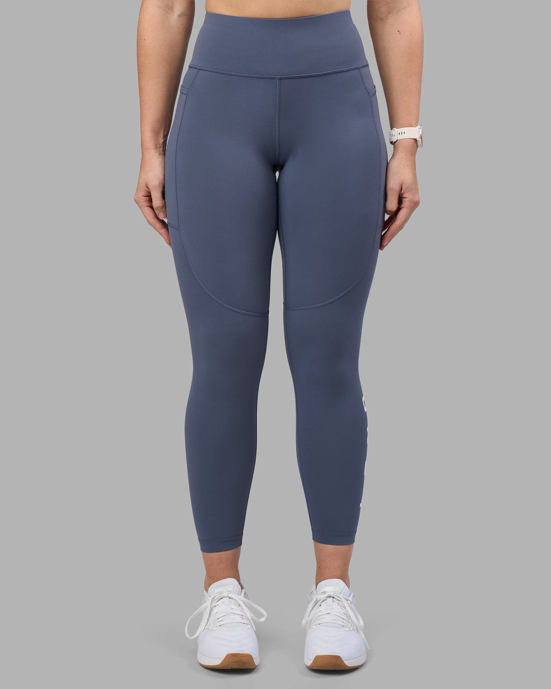 Woman wearing Rep Ultra High-Rise 7/8 Legging Pockets - Night Shadow-White | Model:Amy | Size:M