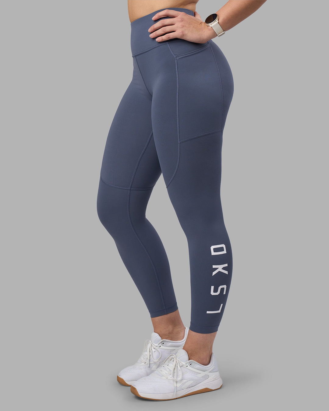 Woman wearing Rep Ultra High-Rise 7/8 Legging Pockets - Night Shadow-White | Model:Amy | Size:M