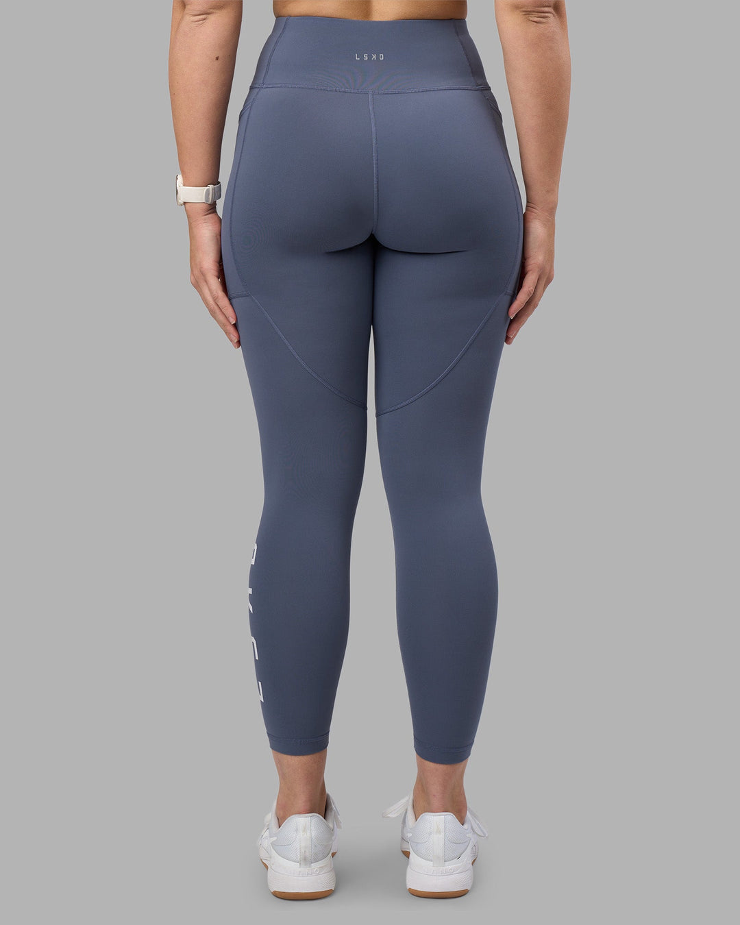 Woman wearing Rep Ultra High-Rise 7/8 Legging Pockets - Night Shadow-White | Model:Amy | Size:M