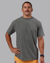 Man wearing Rise & Lift Washed FLXCotton Oversized Tee - Graphite-Purple Opulence | Model:Jaiden | Size:M