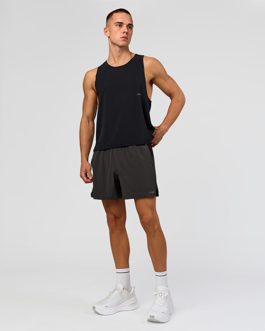 Man wearing Run Club Elevate Pace Running Tank - Black-Onyx | Model:Albert | Size:M