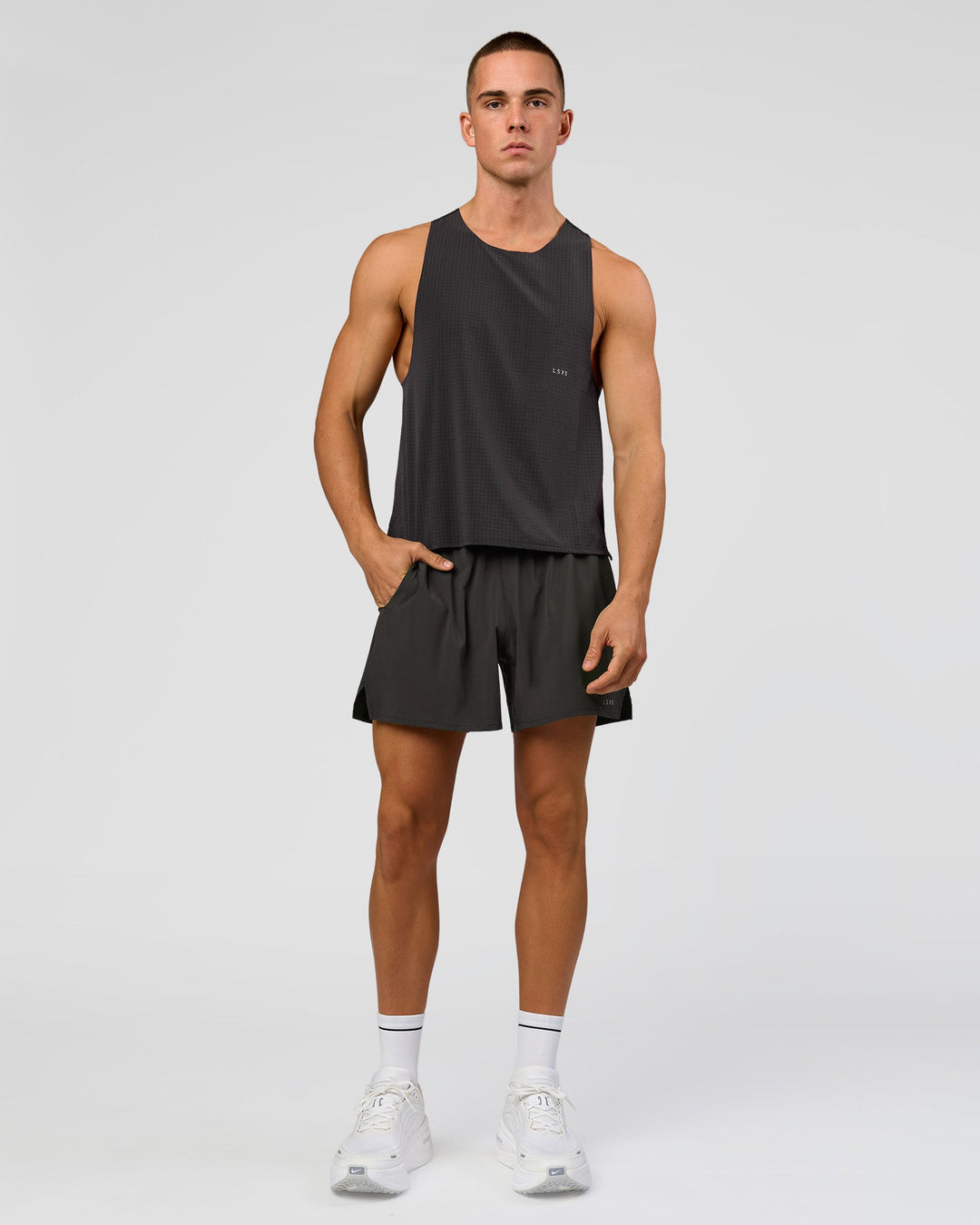 Man wearing Run Club Elevate Pace Running Tank - Onyx-Black | Model:Albert | Size:M