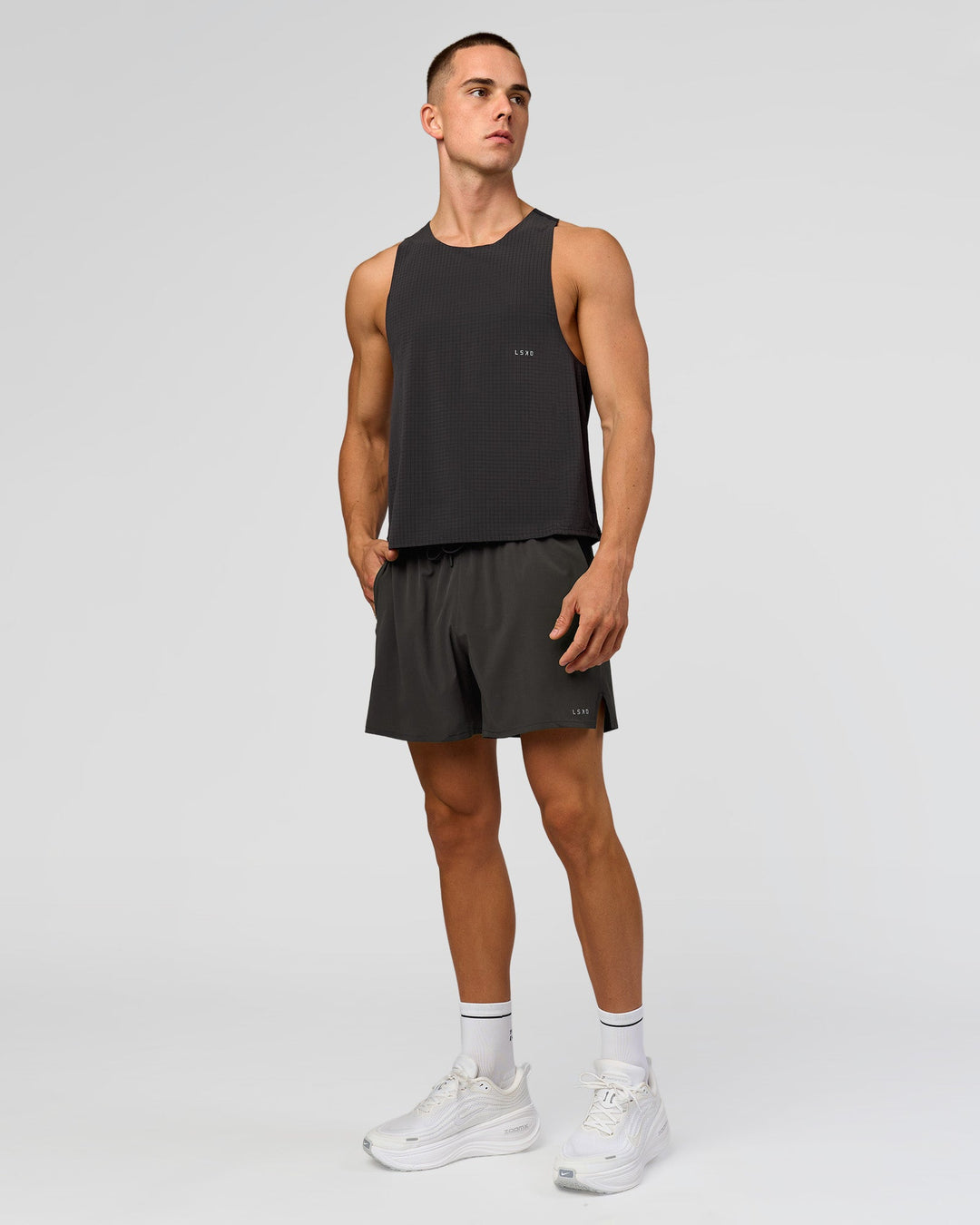 Man wearing Run Club Elevate Pace Running Tank - Onyx-Black | Model:Albert | Size:M