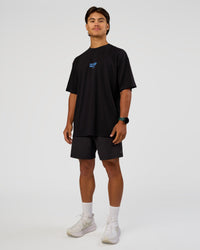 Man wearing Run Club Script FLXCotton Oversized Tee - Black-Palace Blue | Model:George | Size:M