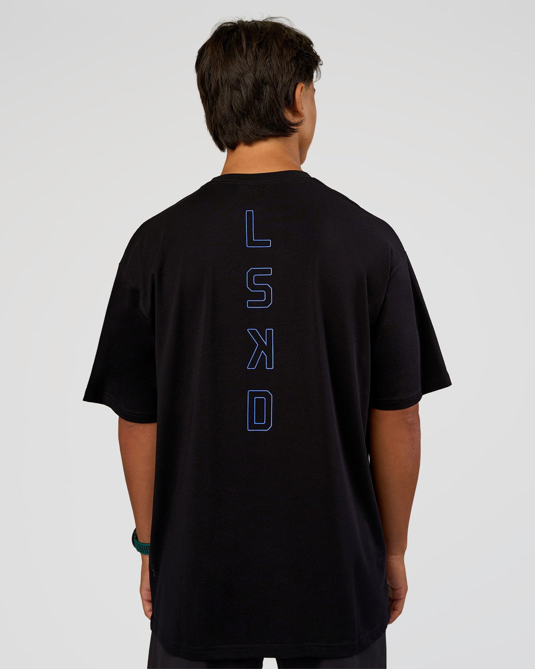 Man wearing Run Club Script FLXCotton Oversized Tee - Black-Palace Blue | Model:George | Size:M