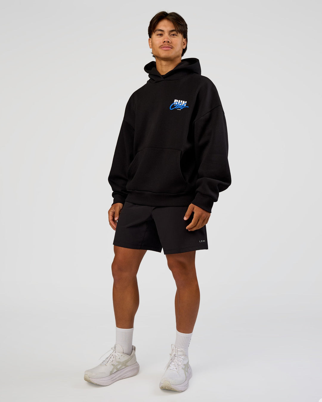 Man wearing Run Club Script Oversized Hoodie - Black-Palace Blue | Model:George | Size:M