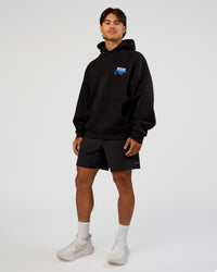 Man wearing Run Club Script Oversized Hoodie - Black-Palace Blue | Model:George | Size:M