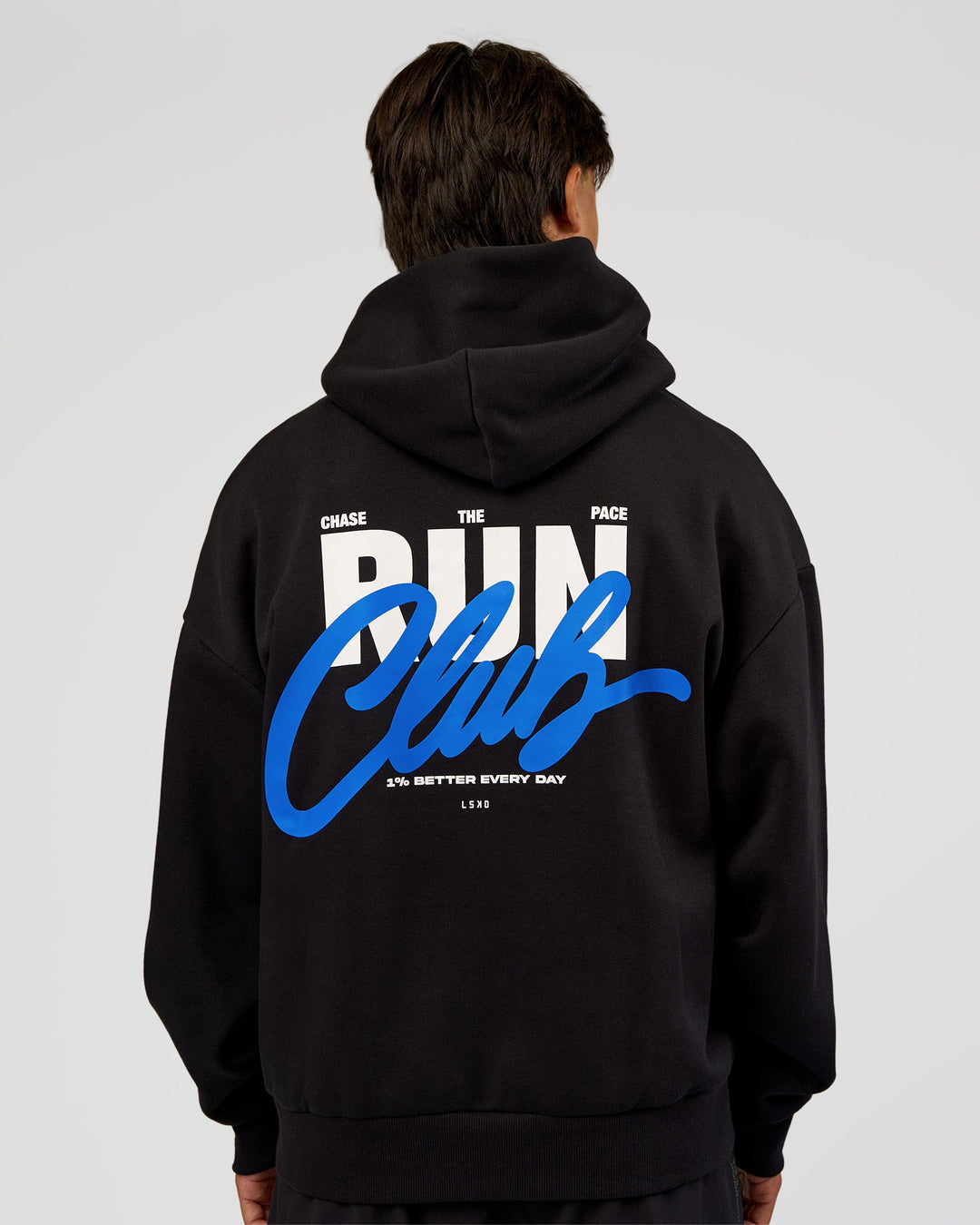 Man wearing Run Club Script Oversized Hoodie - Black-Palace Blue | Model:George | Size:M