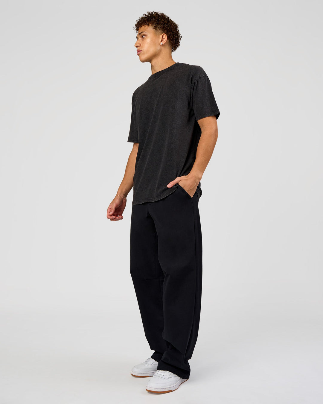 Man wearing Shadow Mode FLXCotton Oversized Tee - Black Washed | Model:Leandro | Size:M
