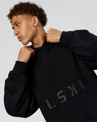 Man wearing Shadow Mode Oversized Hoodie - Black | Model:Leandro | Size:M | Thumbnail Index: 1