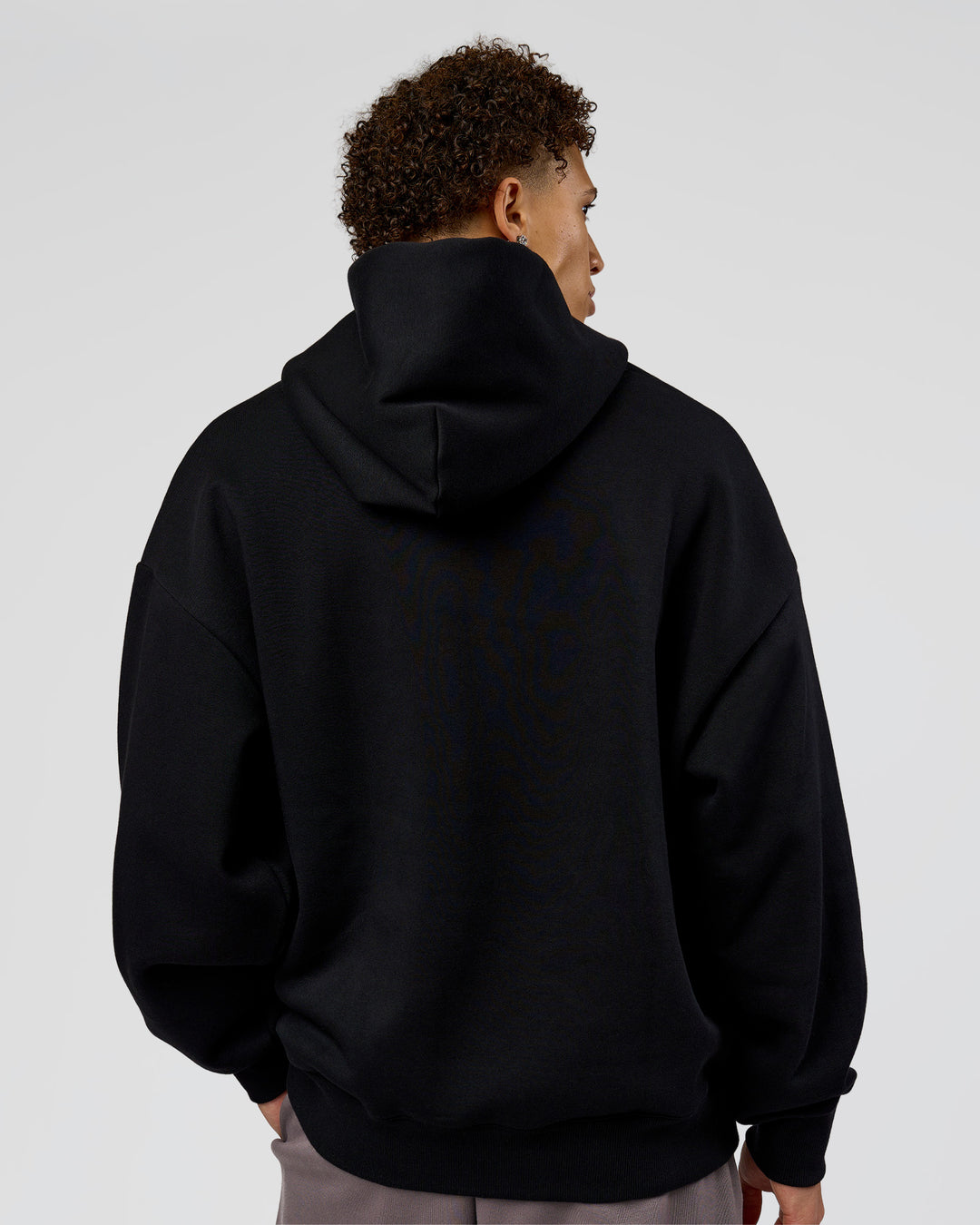Man wearing Shadow Mode Oversized Hoodie - Black | Model:Leandro | Size:M - view 7