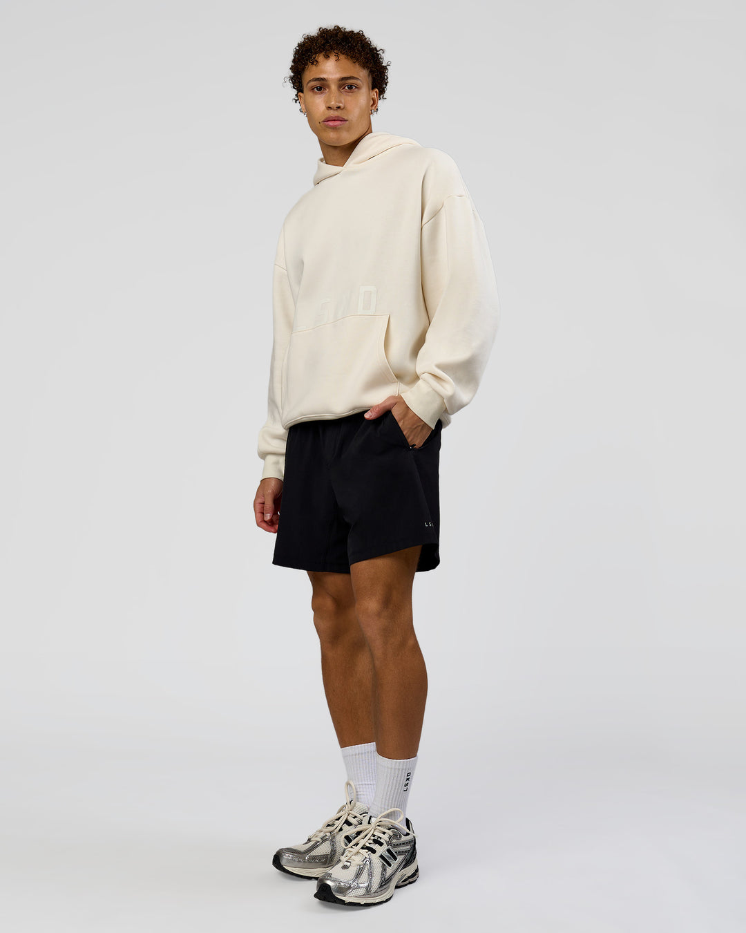 Man wearing Shadow Mode Oversized Hoodie - Off White | Model:Leandro | Size:M