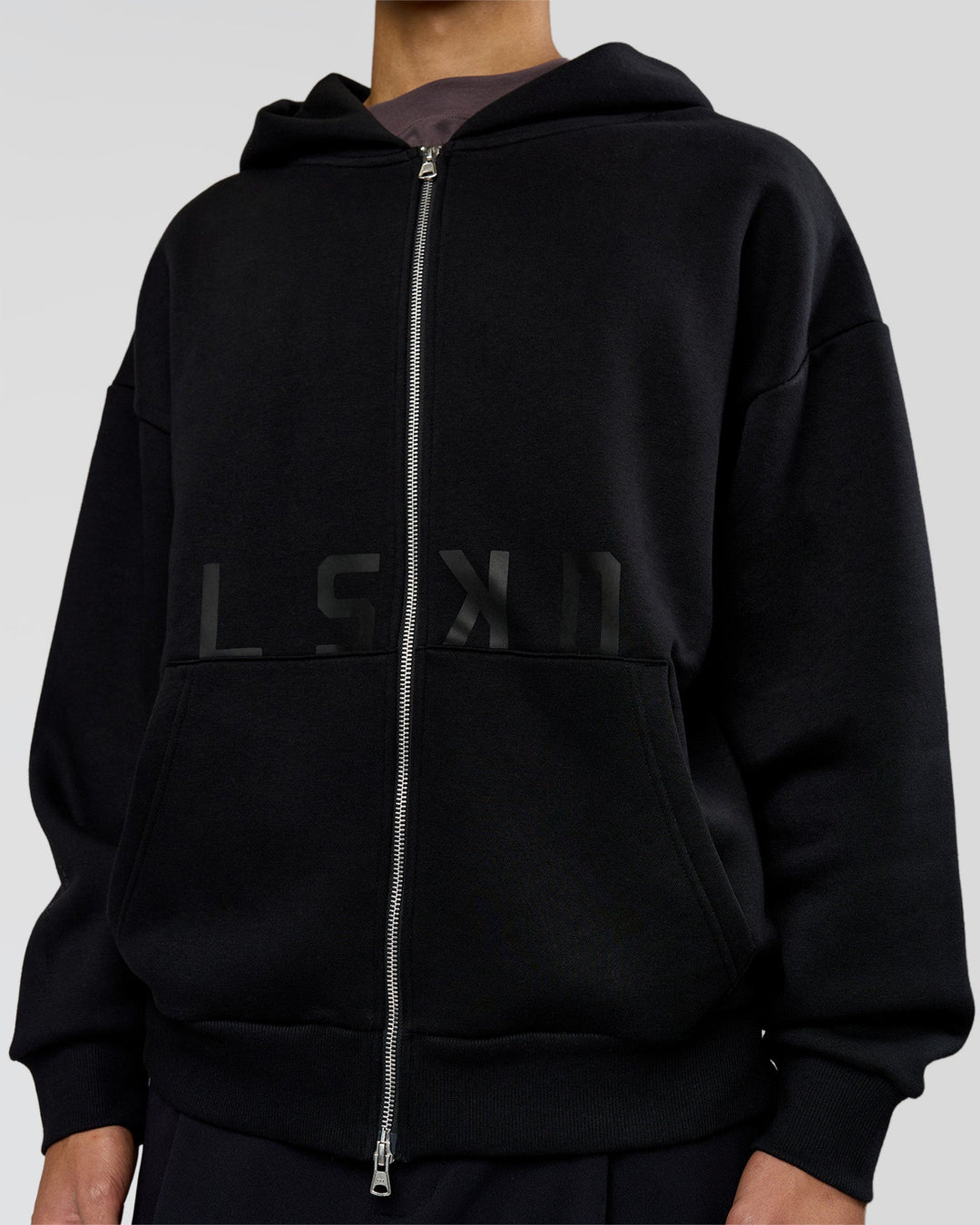 Man wearing Shadow Mode Oversized Zip Through Hoodie - Black | Model:Leandro | Size:M