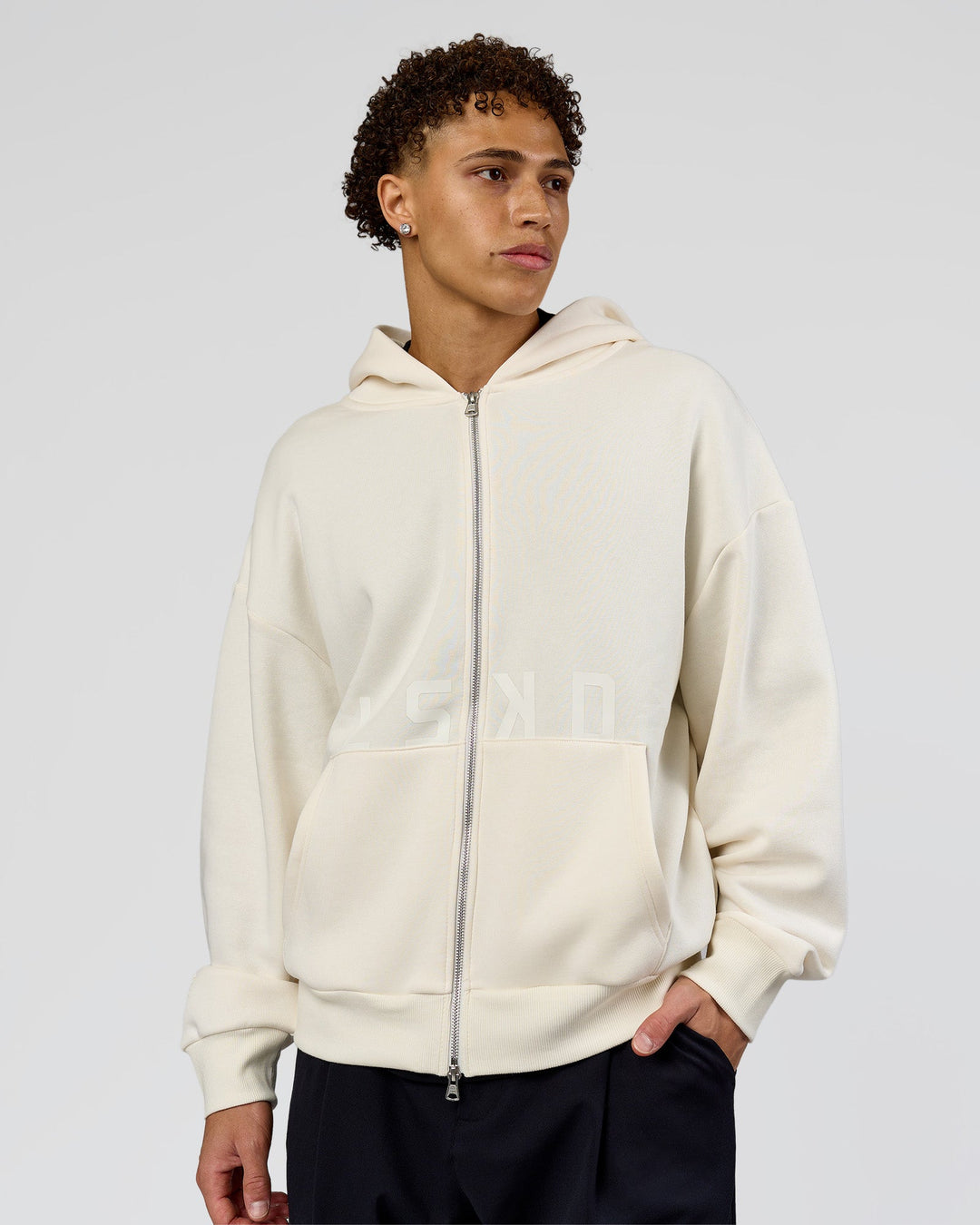 Man wearing Shadow Mode Oversized Zip Through Hoodie - Off White | Model:Leandro | Size:M - view 2