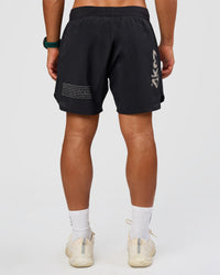 Man wearing Static Grit Lift 6" Short - Black-Alloy | Model:George | Size:M
