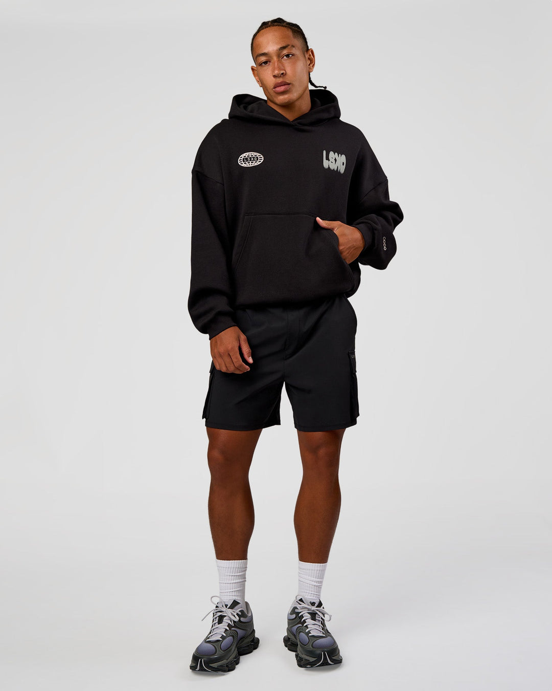 Man wearing Static Grit Unisex Boxy Hoodie - Black-Alloy | Model:Malebo | Size:M