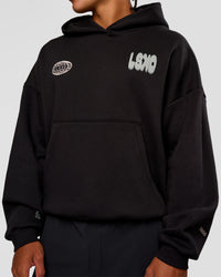 Man wearing Static Grit Unisex Boxy Hoodie - Black-Alloy | Model:Malebo | Size:M
