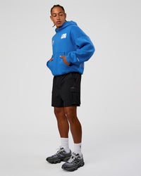 Man wearing Static Grit Unisex Boxy Hoodie - Palace Blue-White | Model:Malebo | Size:M