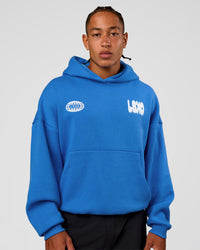 Man wearing Static Grit Unisex Boxy Hoodie - Palace Blue-White | Model:Malebo | Size:M