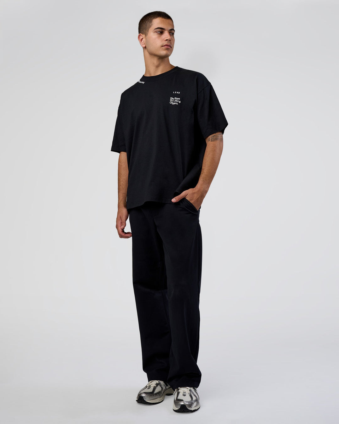 Man wearing Sticker Heavyweight Oversized Tee - Black-White | Model:Zoran | Size:M