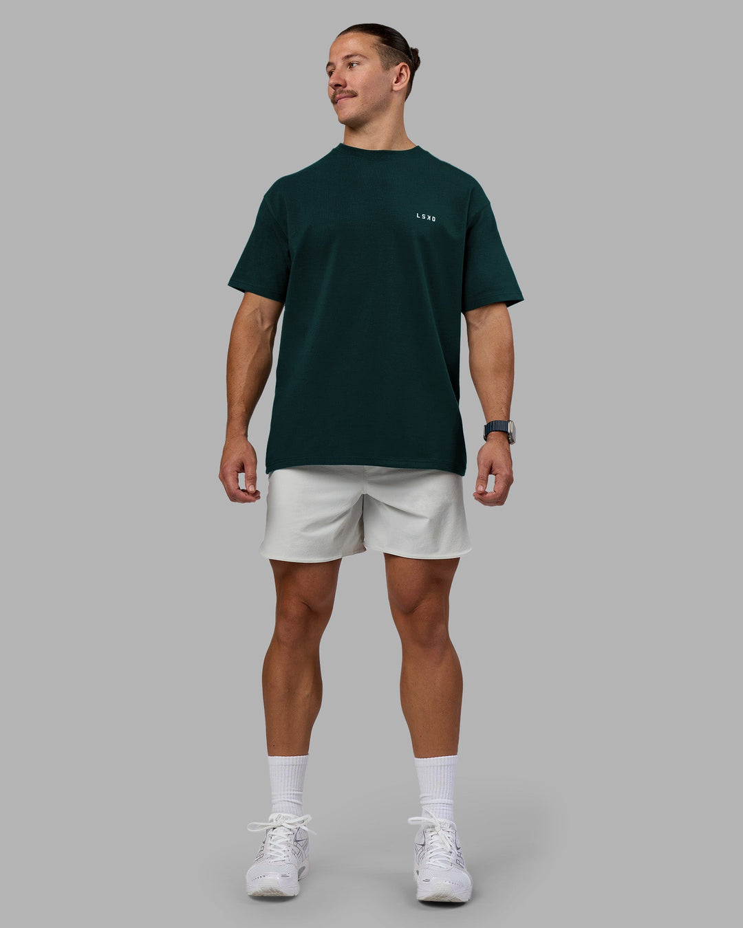 Man wearing Think Strong Heavyweight FLXCotton Tee Oversize - Dark Moss-Off White | Model:Jaiden | Size:M