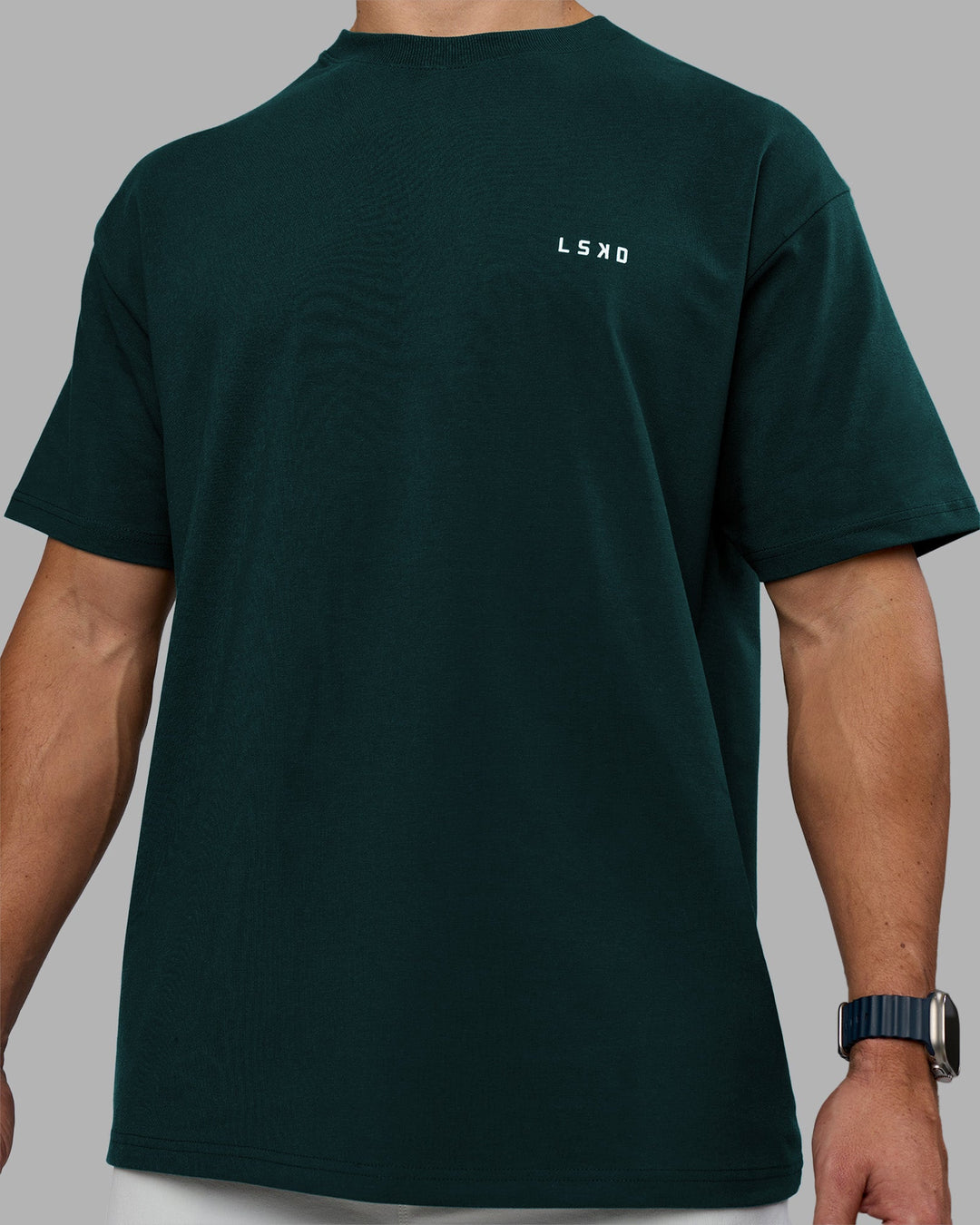 Man wearing Think Strong Heavyweight FLXCotton Tee Oversize - Dark Moss-Off White | Model:Jaiden | Size:M