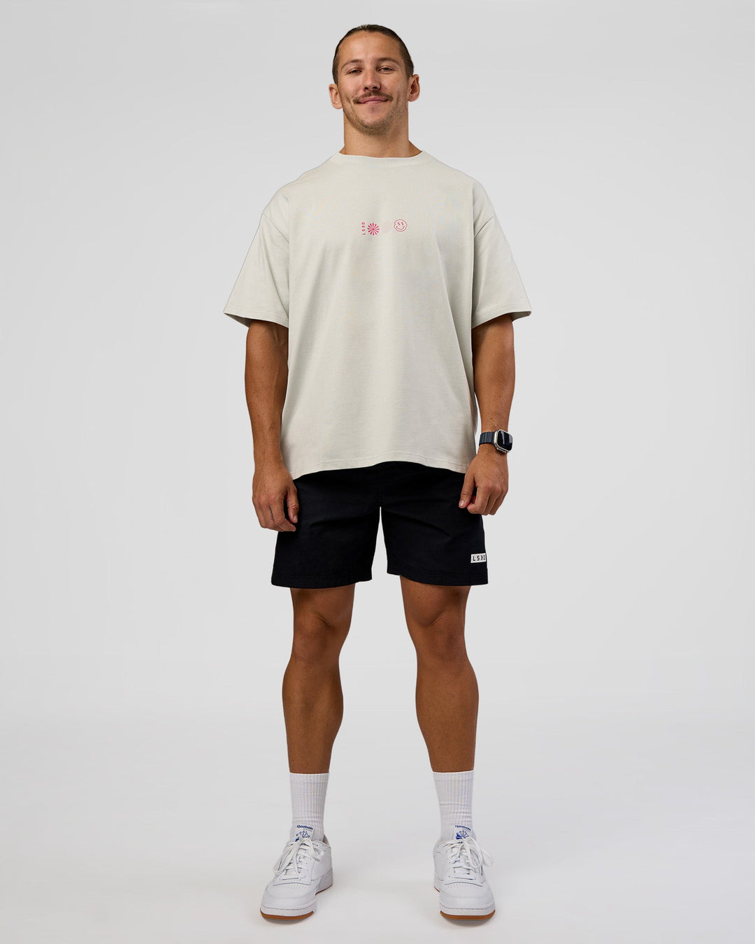Man wearing Trust The Process Heavyweight Unisex Oversized Tee - Digital Mist-Ultra Pink | Model:Jaiden | Size:M