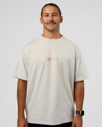 Man wearing Trust The Process Heavyweight Unisex Oversized Tee - Digital Mist-Ultra Pink | Model:Jaiden | Size:M