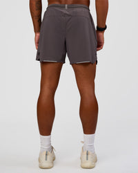 Man wearing UltraAir 5" Lined Performance Short - Duskstone | Model:Malebo | Size:M