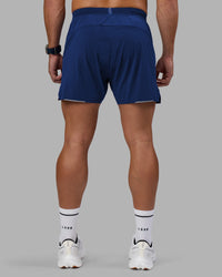 Man wearing UltraAir 5" Lined Performance Short - Midnight Blue | Model:Jaiden | Size:M