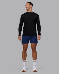 Man wearing UltraAir 5" Lined Performance Short - Midnight Blue | Model:Jaiden | Size:M