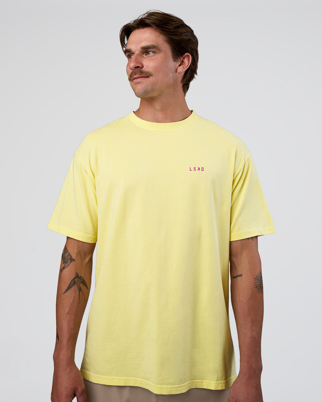 Man wearing Unfit Club FLXCotton Oversized Tee - Yellow Fizz Washed-Ultra Fuchsia | Model:Konnor | Size:M