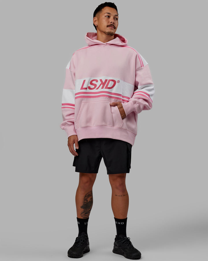 Man wearing Unisex A-Team Hoodie Oversize - Petal Pink-White