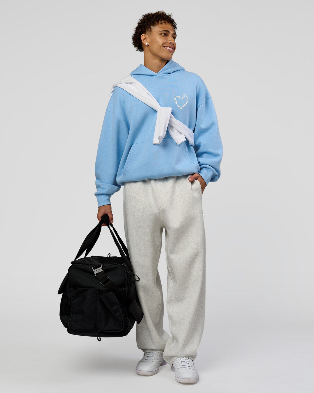 Man wearing Unisex Love The Process Oversize Hoodie - Open Air-Off White | Model:Leandro | Size:M