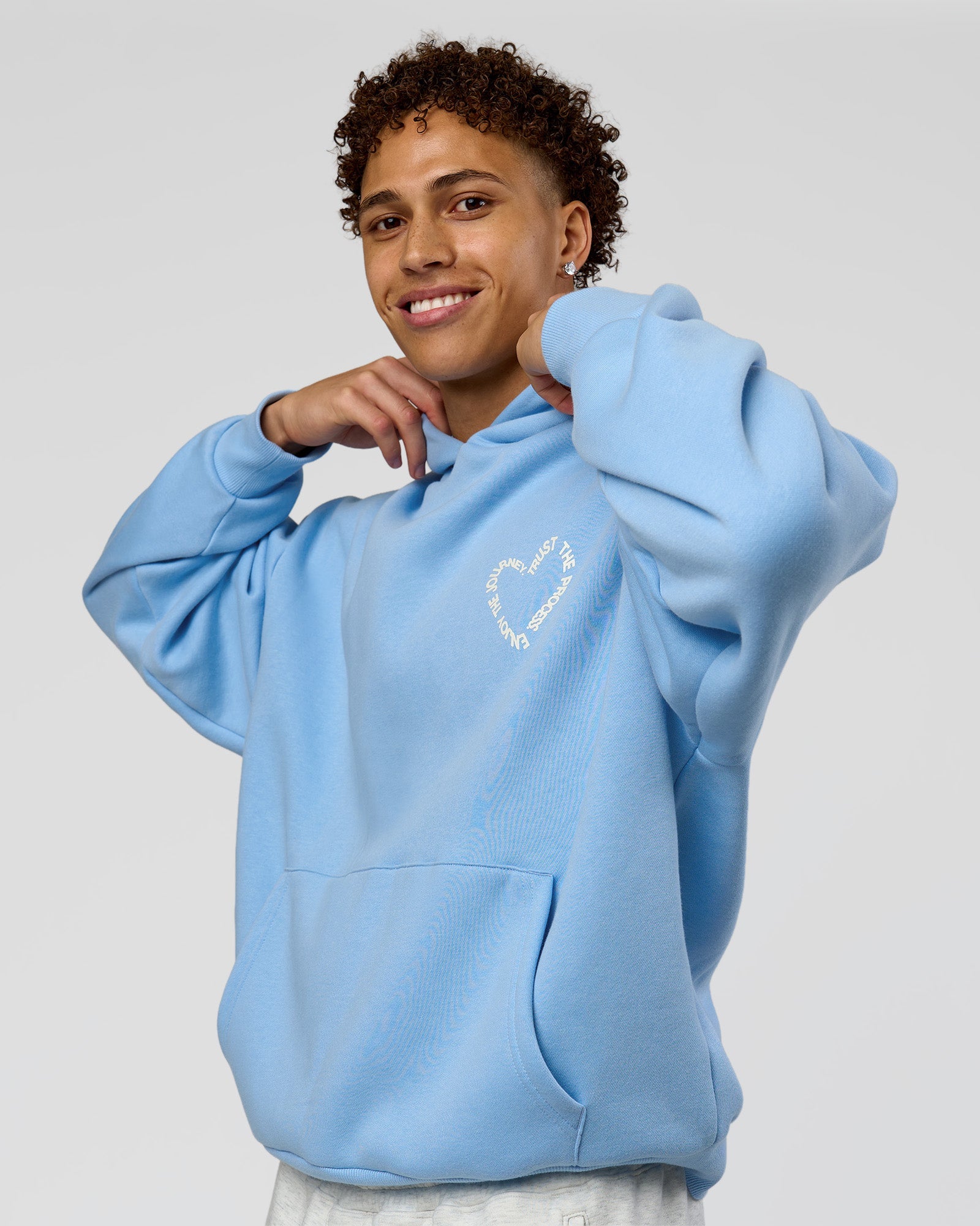 Man wearing Unisex Love The Process Oversize Hoodie - Open Air-Off White | Model:Leandro | Size:M