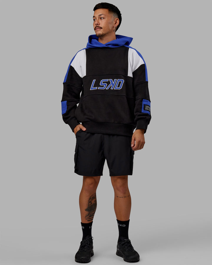Man wearing Unisex Slam Hoodie Oversize - Black-Power Cobalt