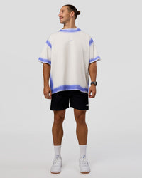 Man wearing Urban Blur Heavyweight Unisex Oversized Tee - Off White-Power Cobalt | Model:Jaiden | Size:M