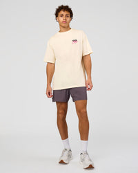 Man wearing Values Run Club FLXCotton Tee - Off White-Candy Pink | Model:Leandro | Size:M