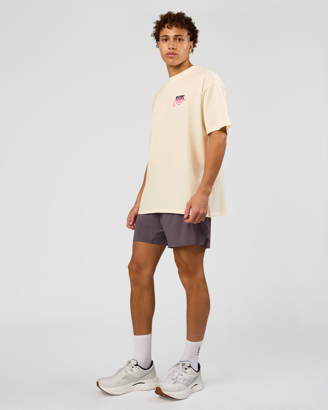 Man wearing Values Run Club FLXCotton Tee - Off White-Candy Pink | Model:Leandro | Size:M