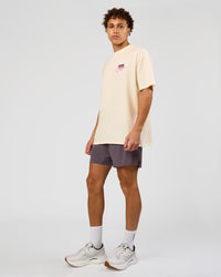 Man wearing Values Run Club FLXCotton Tee - Off White-Candy Pink | Model:Leandro | Size:M