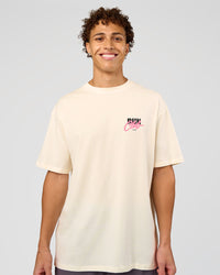 Man wearing Values Run Club FLXCotton Tee - Off White-Candy Pink | Model:Leandro | Size:M