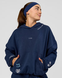 Woman wearing Zola Oversized Hoodie - Future Navy | Model:Grace | Size:M