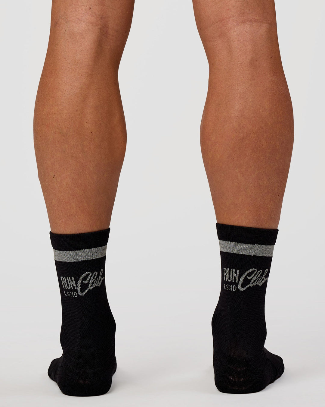 Man wearing Run Club Fast Performance Socks 2.0 - Black-Reflective - view 3