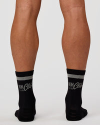 Man wearing Run Club Fast Performance Socks 2.0 - Black-Reflective | Thumbnail Index: 2
