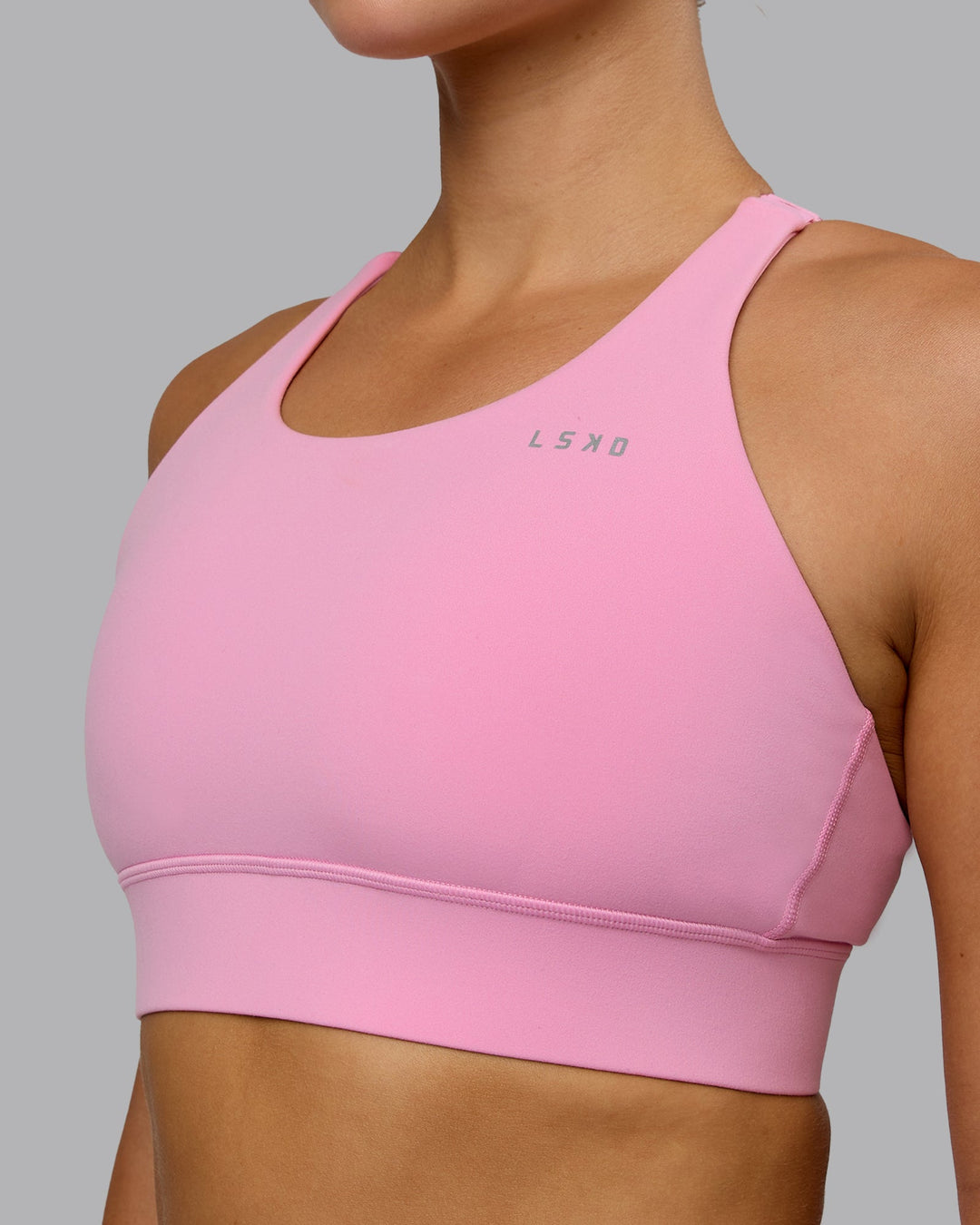 Woman wearing Accelerate Sports Bra - Bubblegum